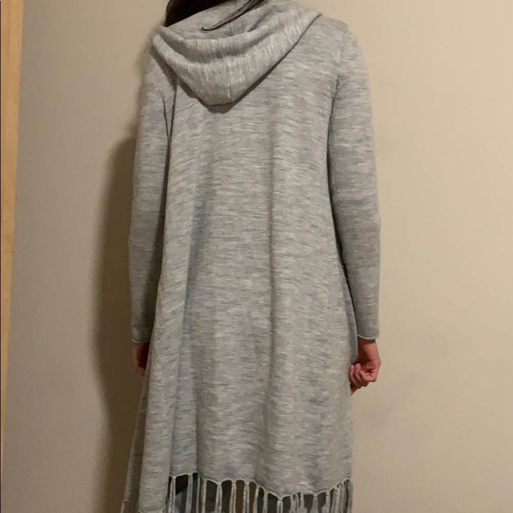 A must buy “ wool sweater “ with fringe